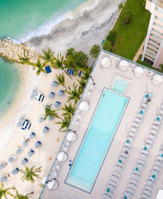 Aerial shot of pool and gulf beach